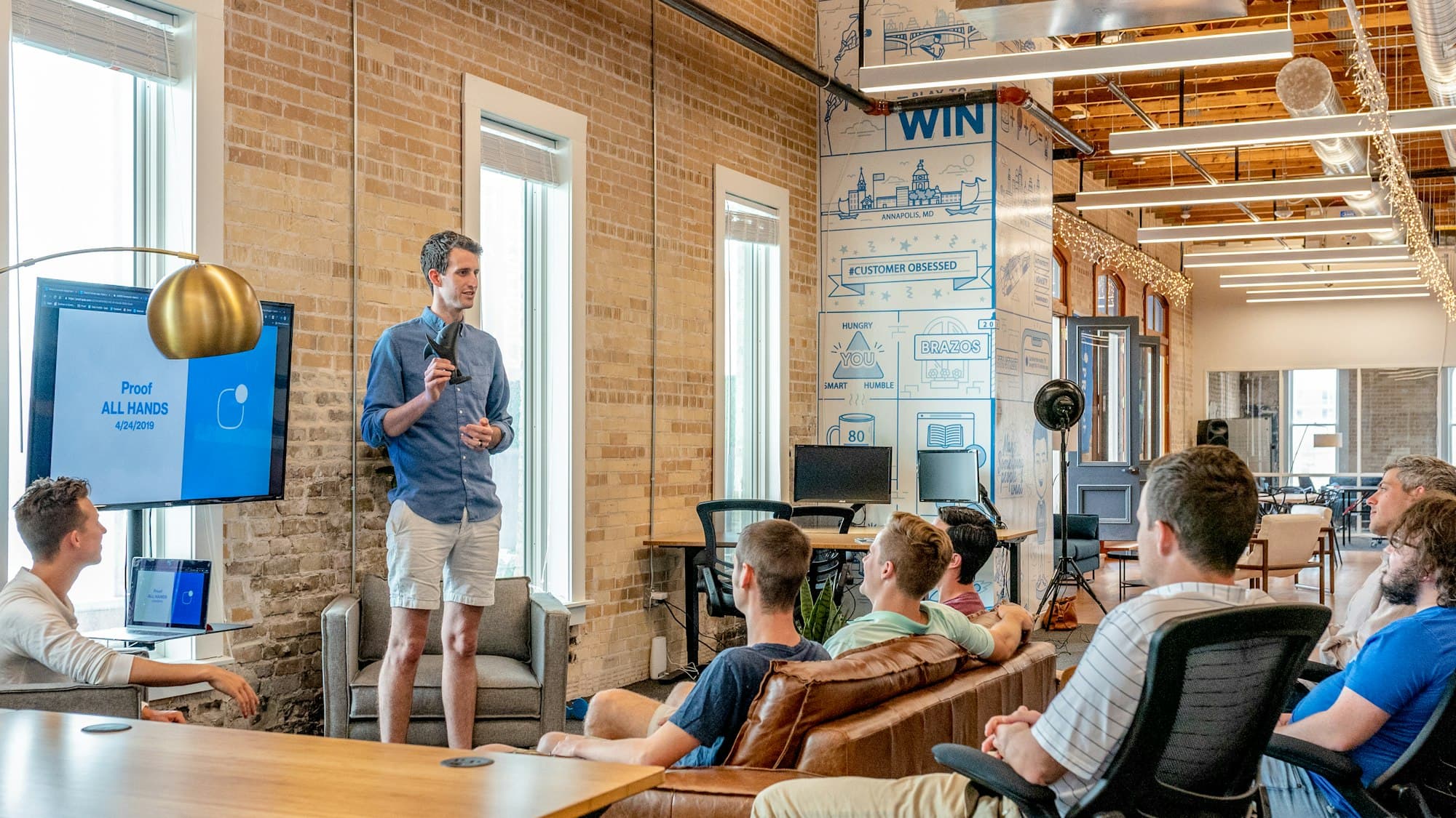 An instructor leading an in-person session for a small group of learners